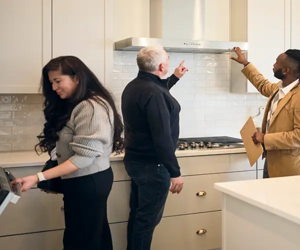 People inspecting a kitchen