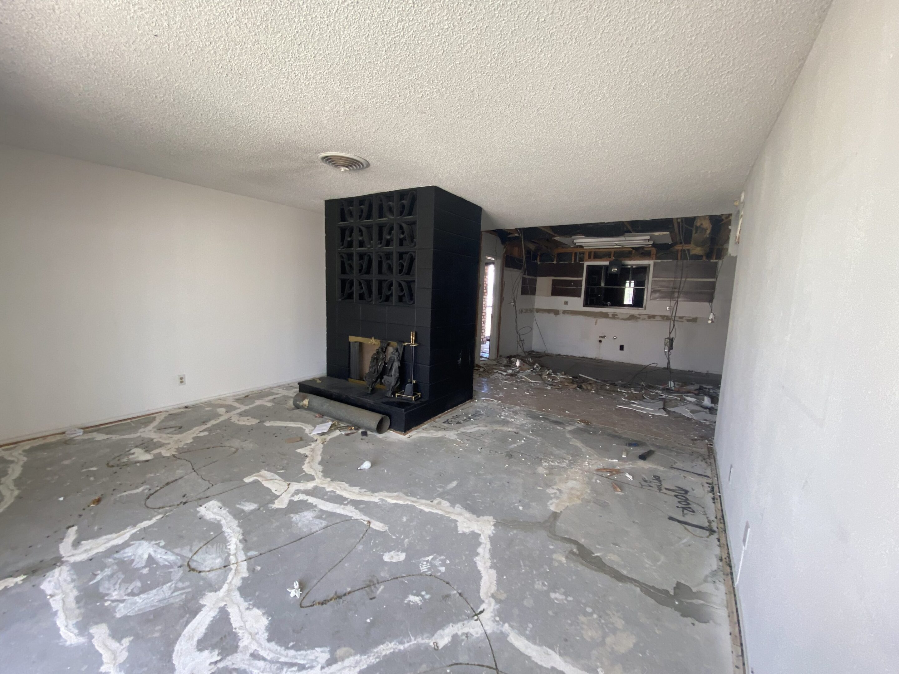 Living room under renovation with black fireplace