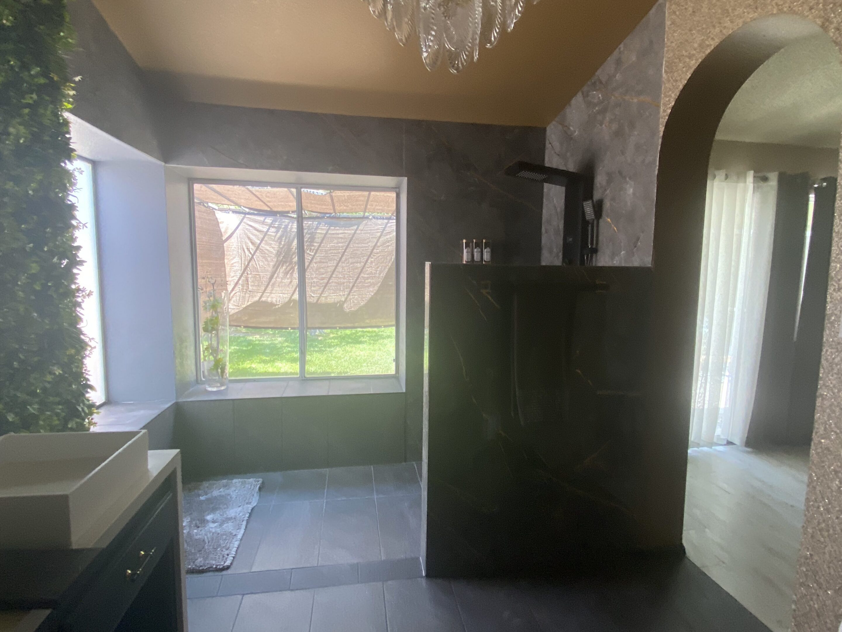 Modern bathroom with walk-in shower and window