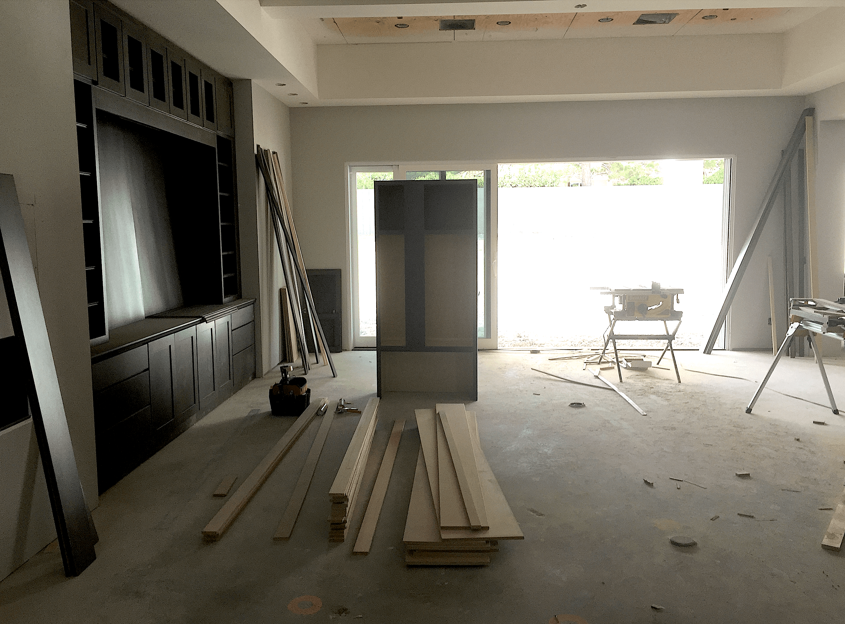 Living room under construction with scattered lumber